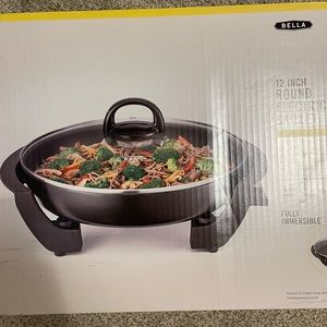 Round electric skillet. Never used.
